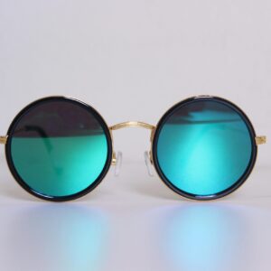 Elegant round sunglasses with blue-tinted lenses and gold frames, perfect for a trendy fashion statement.